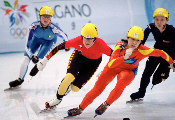 Canada's Annie Perreault (second from left) competes in the short track speed skating event at the 1998 Nagano Winter Olympic Games. (CP Photo/ COA/ Scott Grant)