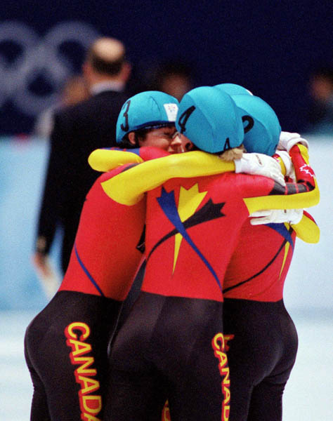 Canada's women's relay team Isabelle Charest, Christine Boudrias, Tania Vincent and Annie Perreault celebrate after winning the bronze medal in the women's short track speed skating event at the 1998 Nagano Olympic Games . (CP Photo/ COA/Scott Grant)