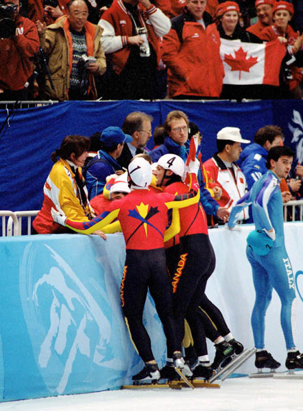 Canada's men's relay team celebrates after winning the gold medal in the short track speed skating event at the 1998 Nagano Olympic Games . (CP Photo/ COA/Scott Grant)