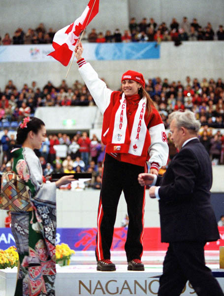 Canada's Susan Auch celebrates after winning the gold medal in the women's long track speed skating event at the 1998 Nagano Winter Olympics. (CP PHOTO/COA)