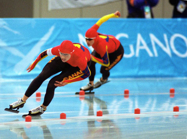 Canada's Susan Auch (left) and Catriona Le May Doan competes in the long track speed skating event at the 1998 Nagano Winter Olympic Games. (CP Photo/ COA/ Scott Grant)