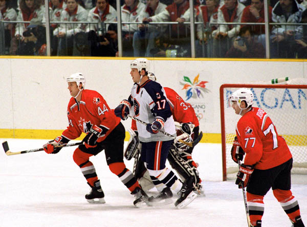 Canada's Robert Blake (44) and Ray Bourque (77) participate in hockey action against the United States at the 1998 Winter Olympics in Nagano. (CP Photo/COA/ F. Scott Grant )