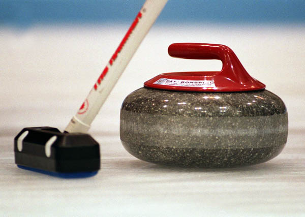 A stone is marked at the curling competition at the 1998 Nagano Winter Olympics. (CP Photo/ COA/ Mike Ridewood)