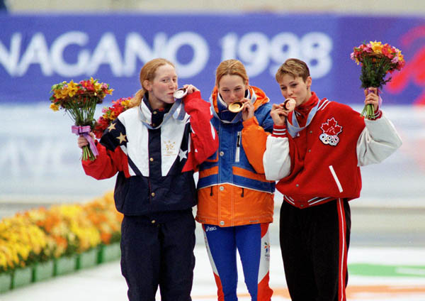 Canada's Catriona Le May Doan (right) celebrates after winning a bronze medal in a long track speed skating event at the 1998 Nagano Winter Olympics. (CP PHOTO/COA/Mike Ridewood)