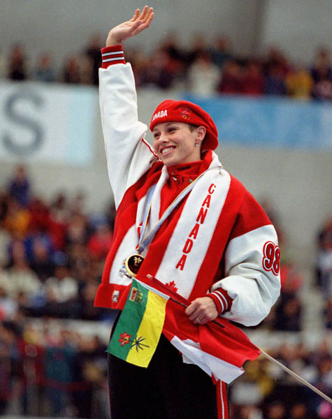 Canada's Catriona Le May Doan celebrates her gold medal win in a long track speed skating event at the 1998 Nagano Winter Olympics. (CP PHOTO/COA/Mike Ridewood)