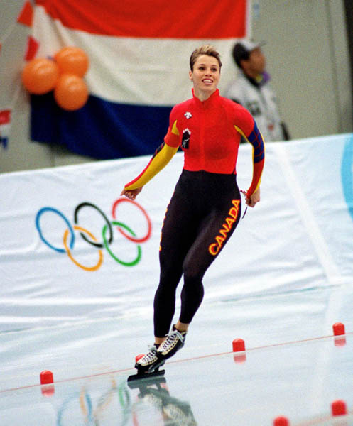 Canada's Catriona Le May Doan celebrates her gold medal win in a long track speed skating event at the 1998 Nagano Winter Olympics. (CP PHOTO/COA/Mike Ridewood)