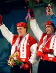 Canada's Pierre Lueders (right) and Dave MacEachern celebrate their gold medal win in the two-man bobsleigh event at the 1998 Nagano Winter Olympics. (CP PHOTO/COA/F. Scott Grant)