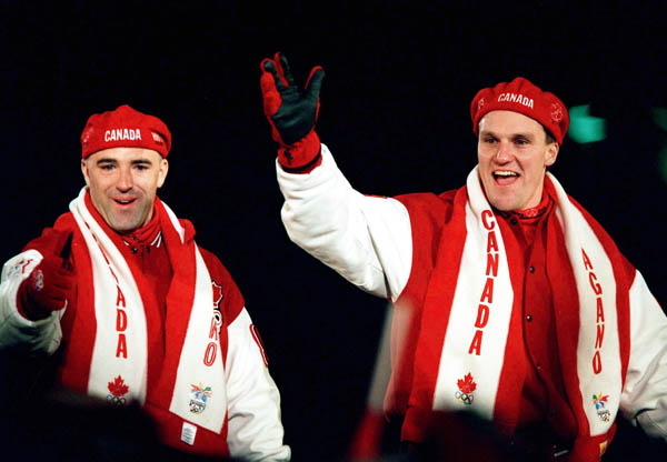 Canada's Pierre Lueders (right) and Dave MacEachern celebrate their gold medal win in the two-man bobsleigh event at the 1998 Nagano Winter Olympics. (CP PHOTO/COA/F. Scott Grant)