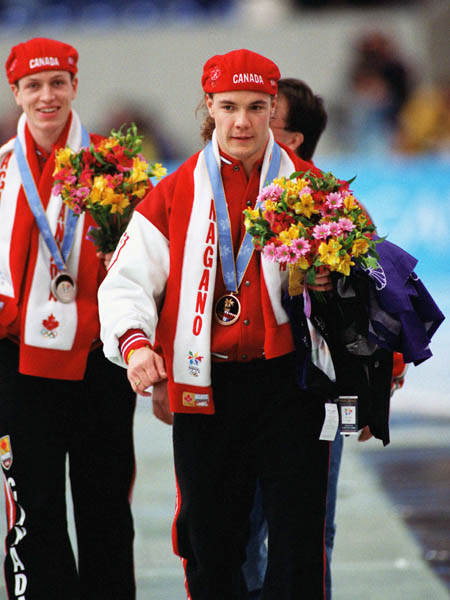 Canadians Jeremy Wotherspoon (left) and Kevin Overland celebrate after winning respectively bronze and silver medals in the long track speed skating event of the 1998 Nagano Winter Olympics.(CP PHOTO/COA)
