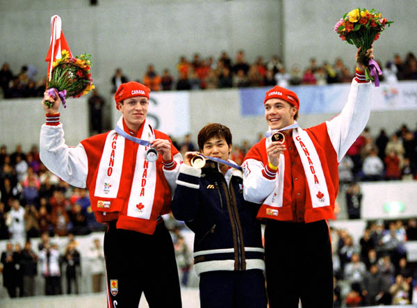 Canadians Jeremy Wotherspoon (left) and Kevin Overland (right) celebrate after winning respectively bronze and silver medals in the long track speed skating event of the 1998 Nagano Winter Olympics.(CP PHOTO/COA)
