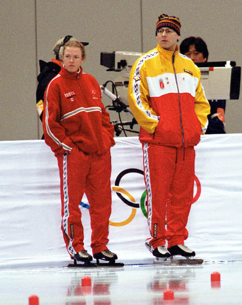 Canada's speed skating coaches Ingrid Paul (left) and Derek Auch watch the performance of their athletes at the 1998 Nagano Winter Olympic Games. (CP Photo/ COA/ Scott Grant)