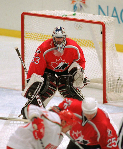Canada's Patrick Roy (goalie) competes in hockey action at the 1998 Winter Olympics in Nagano. (CP Photo/COA/ F. Scott Grant )