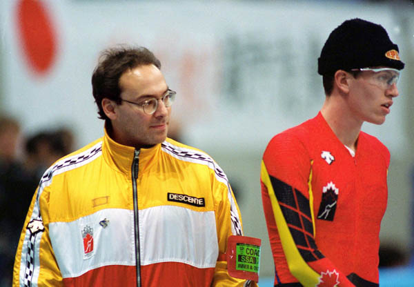 Canada's long track speed skating coach Derek Auch (left) speks with Jeremy Wotherspoon at the 1998 Nagano Winter Olympic Games. (CP Photo/ COA/ Scott Grant)