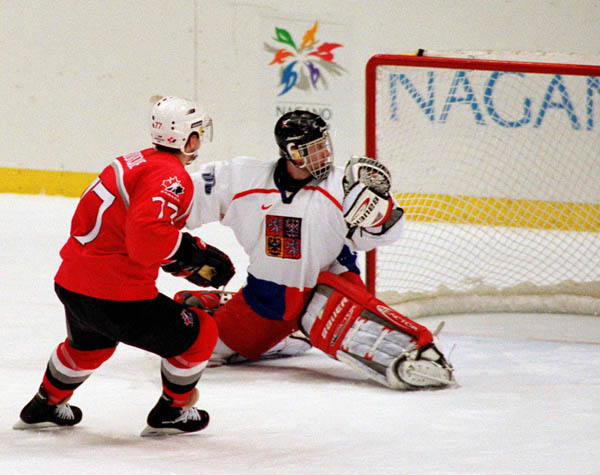 Canada's Ray Bourque (77) competes in hockey action at the 1998 Winter Olympics in Nagano. (CP Photo/COA/ F. Scott Grant )