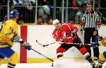 Canada's Eric Desjardins (37) and Theoren Fleury (74) compete in hockey action against the Czech Republic at the 1998 Winter Olympics in Nagano. (CP Photo/COA/ F. Scott Grant )