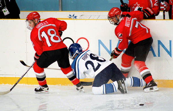 Canada's Nancy Drolet (18) and Jennifer Botterill (7) compete in the women hockey action at the 1998 Nagano Winter Olympics. (CP PHOTO/COA/Mike Ridewood)