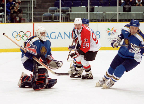 Canada's Wayne Gretzky (99) competes in hockey action against Kazakstan at the 1998 Winter Olympics in Nagano. (CP Photo/COA/ F. Scott Grant )