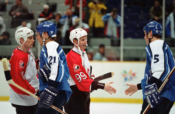Canada's Wayne Gretzky congratulates an opponent at the 1998 Winter Olympics in Nagano. (CP Photo/COA/ F. Scott Grant )