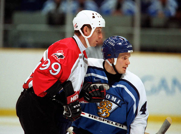 Canada's Wayne Gretzky (99) participates in hockey action against Finland at the 1998 Winter Olympics in Nagano. (CP Photo/COA/ F. Scott Grant )