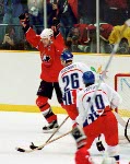 Canada's Eric Lindros (left) celebrates a goal during hockey action against the Czech Republic at the 1998 Winter Olympics in Nagano. (CP Photo/COA/ F. Scott Grant )