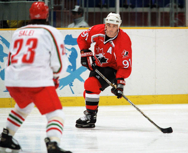 Canada's Joe Sakic (right) competes in hockey action against Belarus at the 1998 Winter Olympics in Nagano. (CP Photo/COA/ F. Scott Grant )