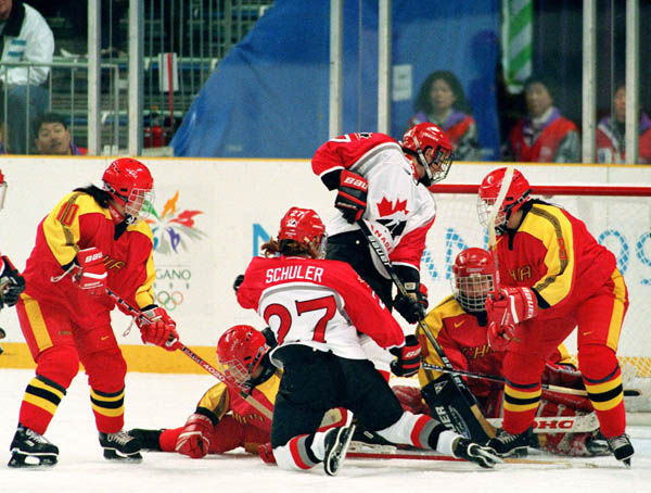 Canada's Laura Schuler (27) competes in women hockey action against China at the 1998 Nagano Winter Olympics. (CP PHOTO/COA/Mike Ridewood)