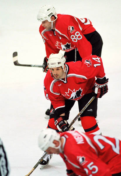 Canada's Eric Lindros (88) and Brendan Shanahan (14) compete in hockey action at the 1998 Winter Olympics in Nagano. (CP Photo/COA/ F. Scott Grant )
