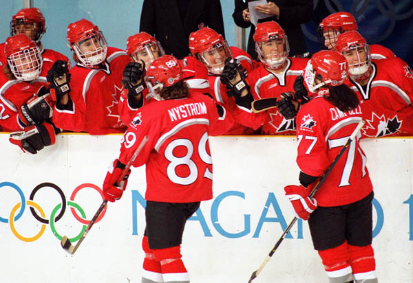 Canada's women hockey team compete at the 1998 Nagano Winter Olympics. (CP PHOTO/COA/Mike Ridewood)