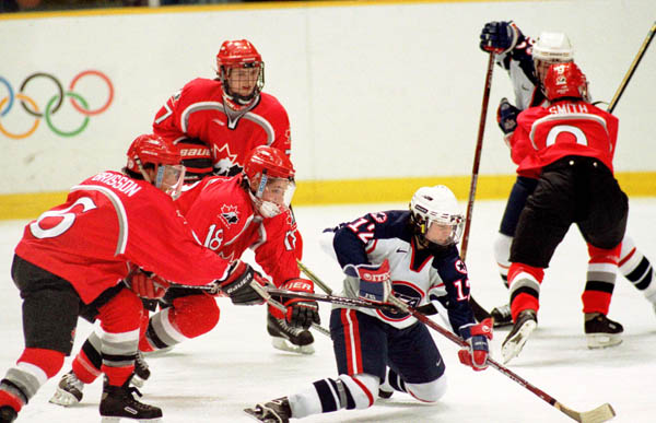 Canada's women hockey team compete in hockey action against the United States at the 1998 Nagano Winter Olympics. (CP PHOTO/COA/Mike Ridewood)