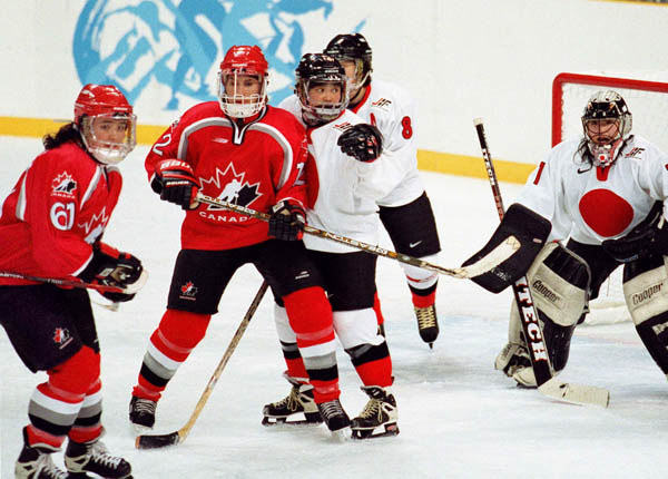 Canada's women hockey team competes in hockey action against Japan at the 1998 Nagano Winter Olympics. (CP PHOTO/COA/Mike Ridewood)