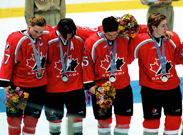 Canada's women hockey team reacts after their gold medal game loss, good for the silver medal, at the 1998 Nagano Winter Olympics. (CP PHOTO/COA/Mike Ridewood)