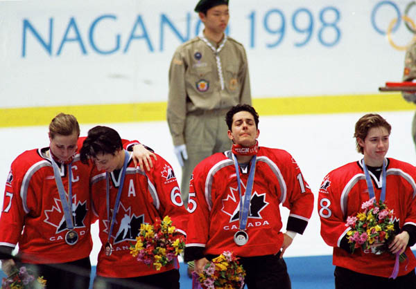 Canada's women hockey team reacts after their gold medal game loss, good for the silver medal, at the 1998 Nagano Winter Olympics. (CP PHOTO/COA/Mike Ridewood)