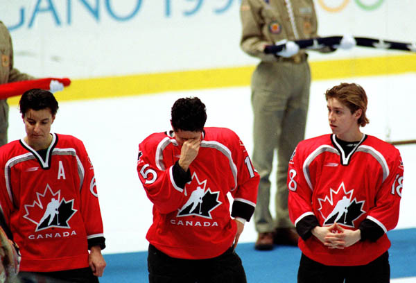 (From left to right) Canada's Therese Brisson, Danielle Goyette and Nancy Drolet react after their gold medal game loss, good for the silver medal, during women hockey action at the 1998 Nagano Winter Olympics. (CP PHOTO/COA/Mike Ridewood)