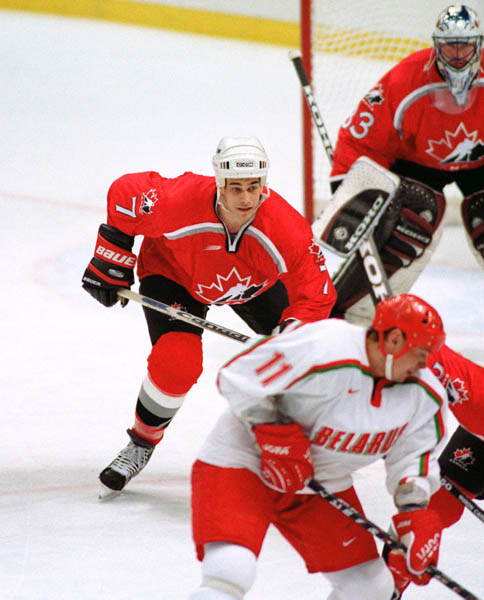 Canada's Rob Zamuner (7) participates in hockey action against Belarus at the 1998 Winter Olympics in Nagano. (CP Photo/COA/ F. Scott Grant )