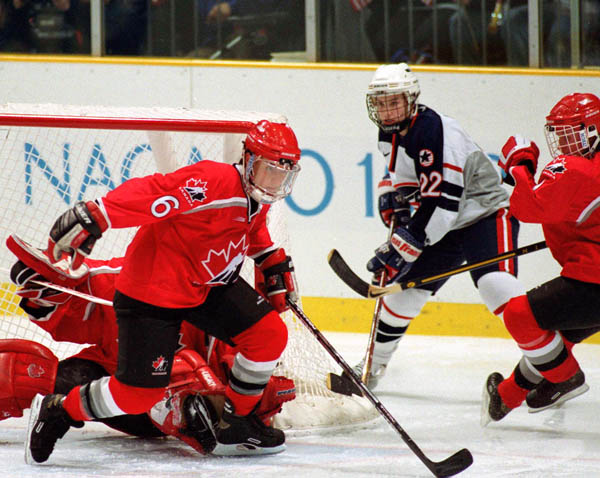 Canada's Therese Brisson (6) competes in women hockey action at the 1998 Nagano Winter Olympics. (CP PHOTO/COA/F. Scott Grant)