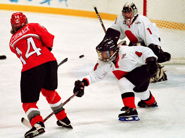 Canada's Kathy McCormack (14) competes in women hockey action against Japan at the 1998 Nagano Winter Olympics. (CP PHOTO/COA/Mike Ridewood)