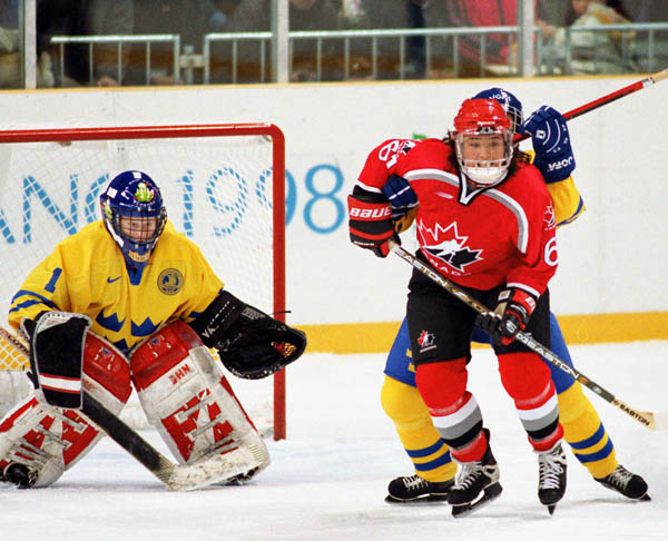 Canada's Vicky Sunohara (right) competes in women hockey action against Sweden at the 1998 Nagano Winter Olympics. (CP PHOTO/COA/Mike Ridewood)