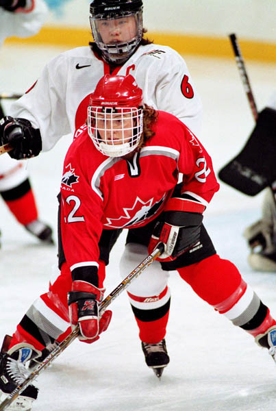 Canada's Hayley Wickenheiser (22) competes in women hockey action against Japan at the 1998 Nagano Winter Olympics. (CP PHOTO/COA/Mike Ridewood)