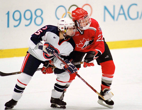 Canada's Hayley Wickenheiser (22) competes in women hockey action against the United States at the 1998 Nagano Winter Olympics. (CP PHOTO/COA/Mike Ridewood)