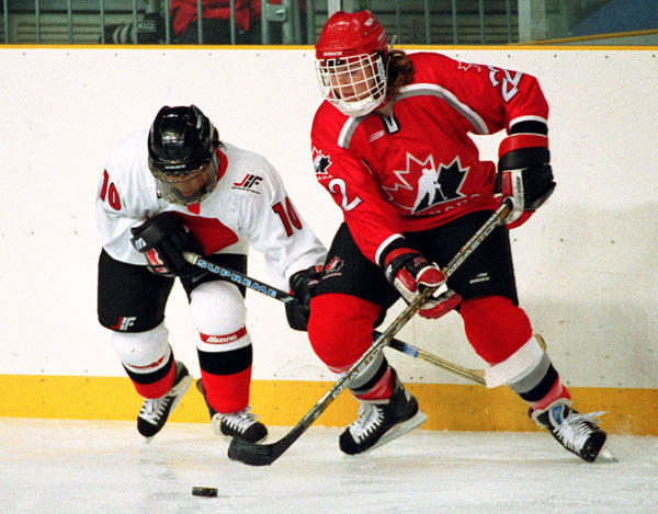 Canada's Hayley Wickenheiser (right) competes in women hockey action against Japan at the 1998 Nagano Winter Olympics. (CP PHOTO/COA/Mike Ridewood)