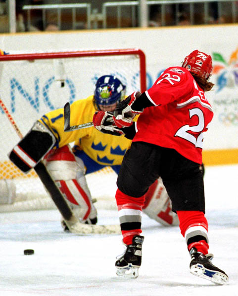 Canada's Hayley Wickenheiser (22) competes in women hockey action against Sweden at the 1998 Nagano Winter Olympics. (CP PHOTO/COA/Mike Ridewood)