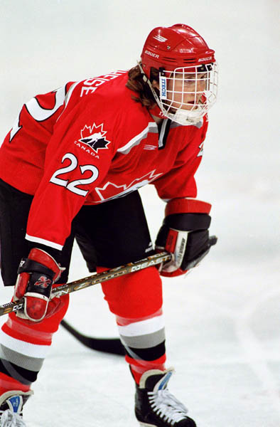 Canada's Hayley Wickenheiser (22) competes in women hockey action at the 1998 Nagano Winter Olympics. (CP PHOTO/COA/Mike Ridewood)