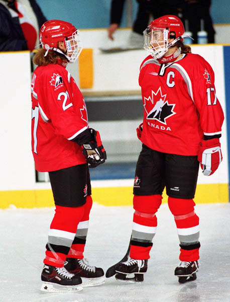 Canada's Judy Diduck (21) and Stacy Wilson (17) compete in women hockey action at the 1998 Nagano Winter Olympics. (CP PHOTO/COA/Mike Ridewood)