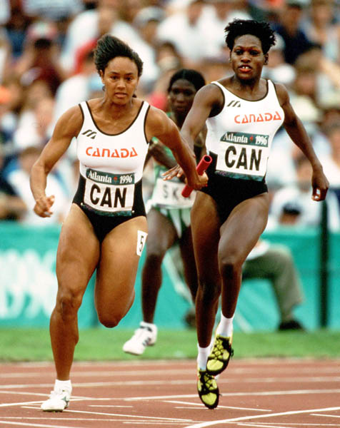 Canada's Lesley Tashlin (left) and Ladonna Antoine competes in an athletics event at the 1996 Olympic games in Atlanta. (CP PHOTO/ COA/Claus Andersen)