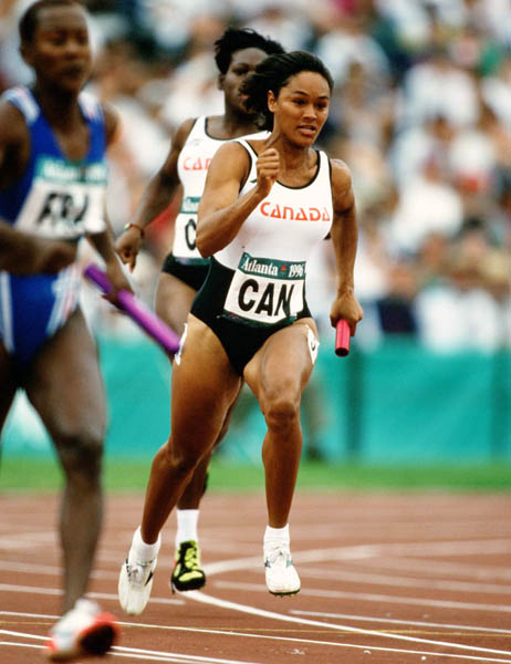 Canada's Lesley Tashlin (front) and Ladonna Antoine (behind) competes in an athletics event at the 1996 Olympic games in Atlanta. (CP PHOTO/ COA/Claus Andersen)