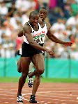 Canada's Donovan Bailey (foreground) and Bruny Surin compete in the men's 4x100m relay at the 1996 Atlanta Summer Olympic Games.(CP Photo/COA/ Claus Andersen)