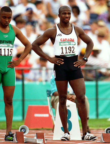 Canada's Donovan Bailey (right) competes in men's 100m event at the 1996 Olympic games in Atlanta. (CP PHOTO/ COA/Claus Andersen)