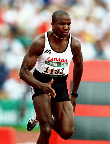 Canada's Donovan Bailey competes in men's 100m event at the 1996 Olympic games in Atlanta. (CP PHOTO/ COA/Claus Andersen)