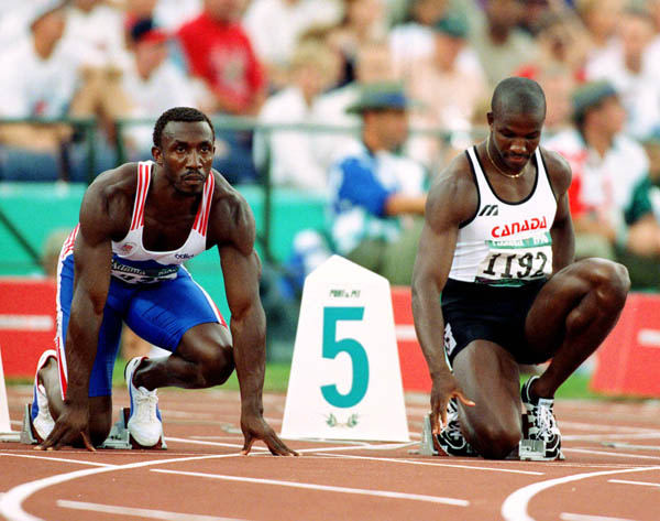 Canada's Donovan Bailey (right) competes in men's 100m event at the 1996 Olympic games in Atlanta. (CP PHOTO/ COA/Claus Andersen)