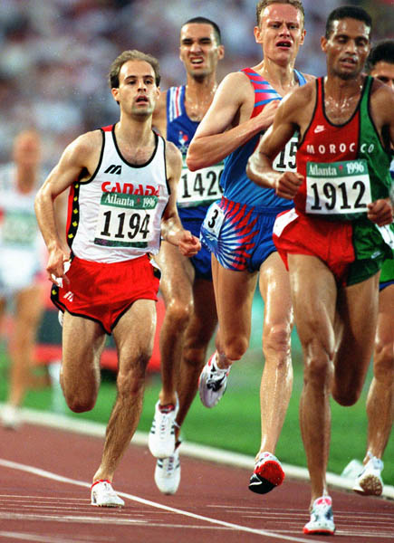 Canada's Joel Bourgeois (left) competes in the 3000m steeplechase at the 1996 Olympic games in Atlanta. (CP PHOTO/ COA/Claus Andersen)